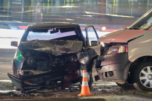 two cars that collided at a busy intersection