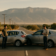 Albuquerque car accident insurance claim delay represented by vehicles and a person tracking claim updates
